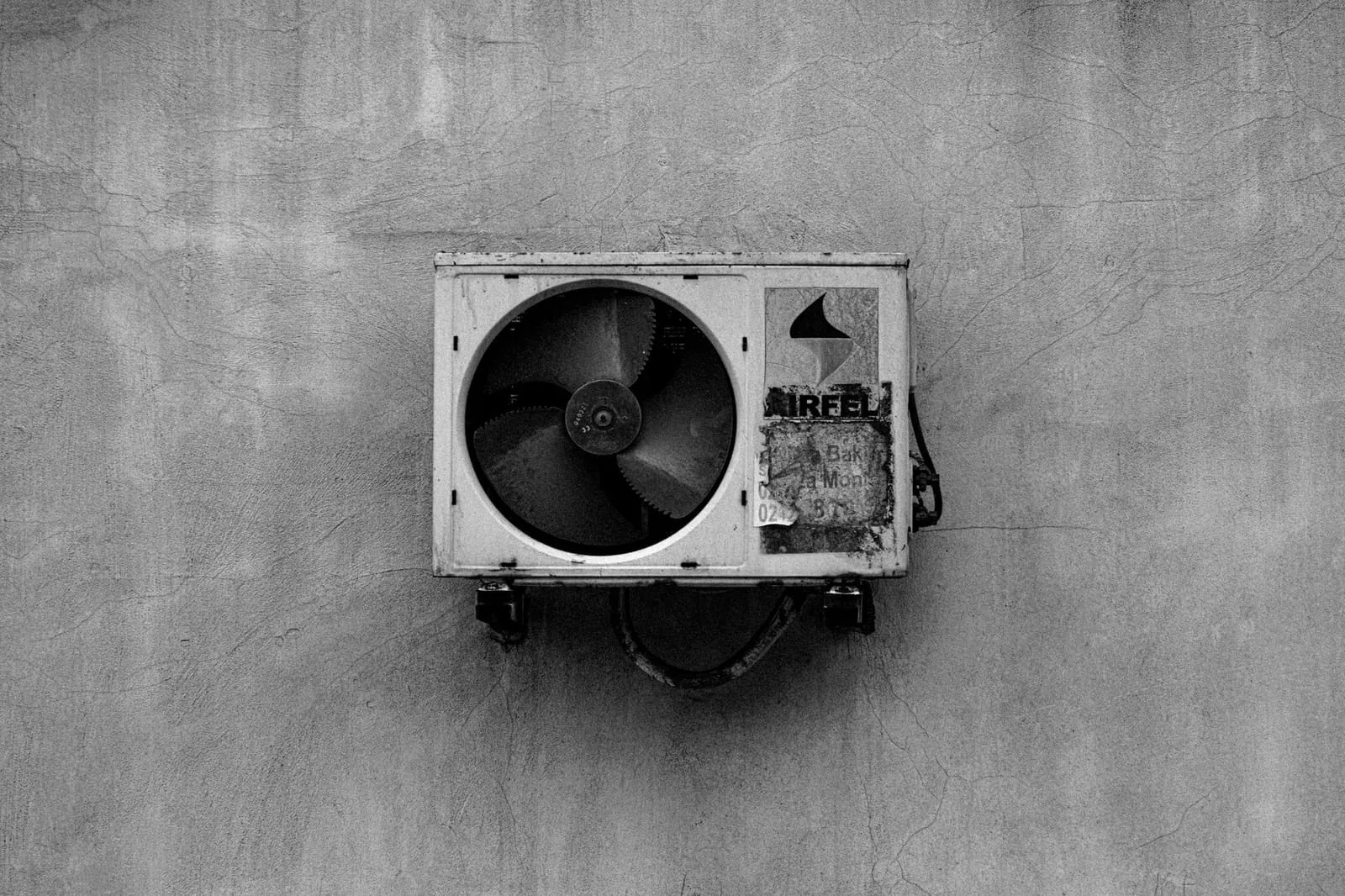 Outdoor HVAC condenser unit beside a home