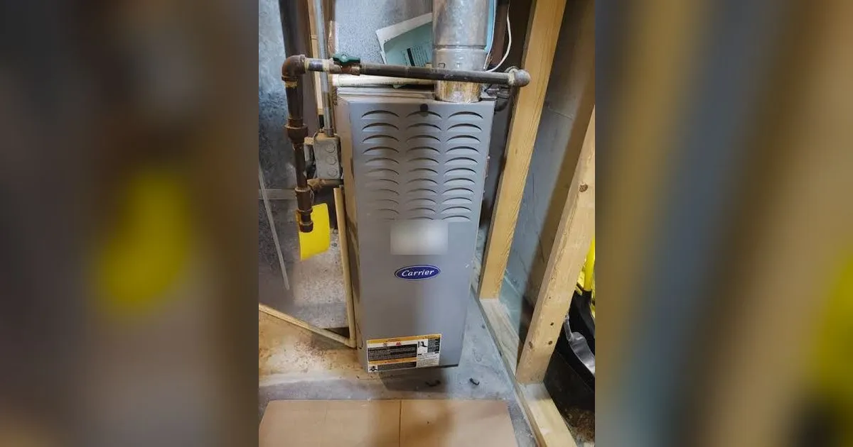 Carrier gas furnace installed in a basement utility room