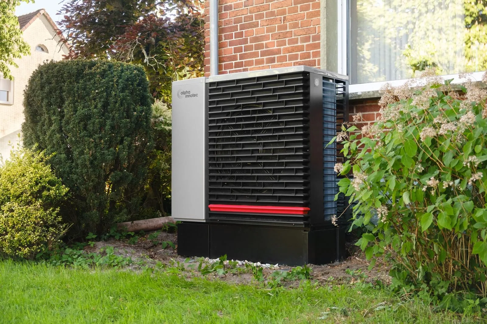 Heat pump unit outside a modern home