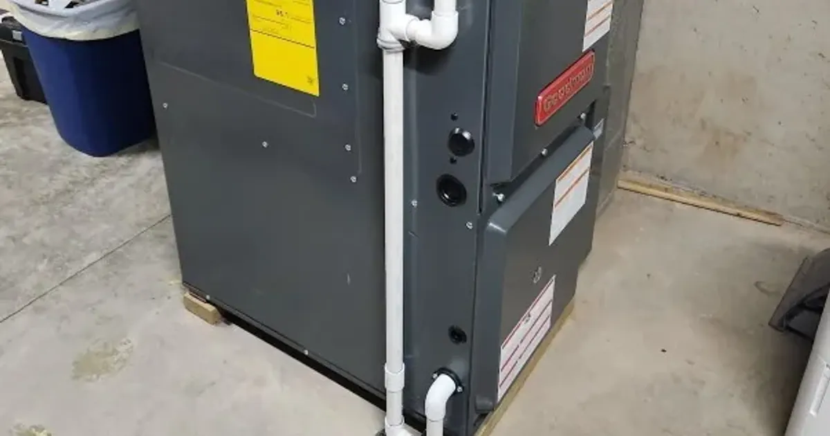 New high-efficiency gas furnace installed on a concrete floor