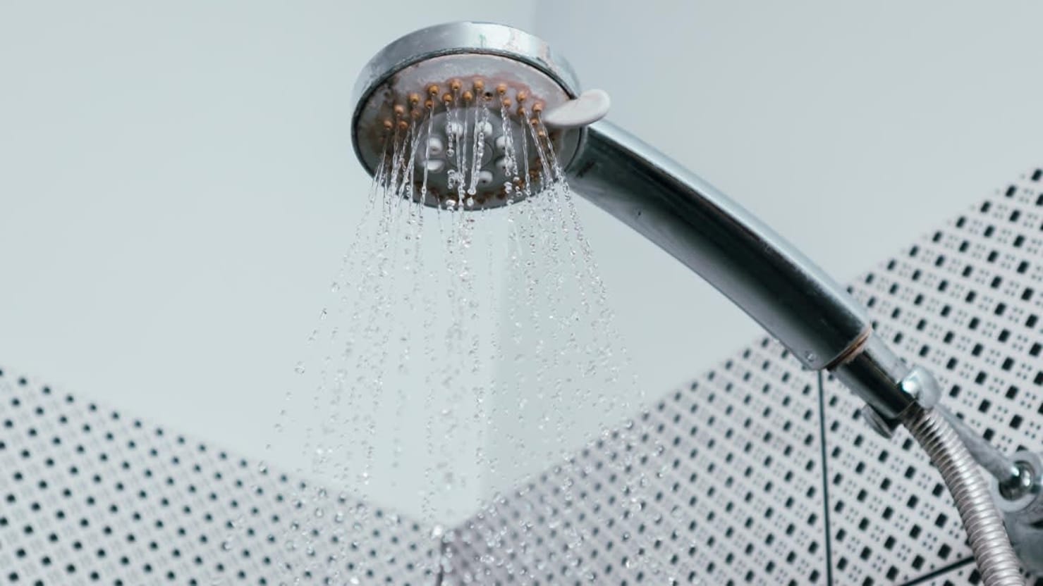 Hard water mineral and limescale buildup on a kitchen faucet