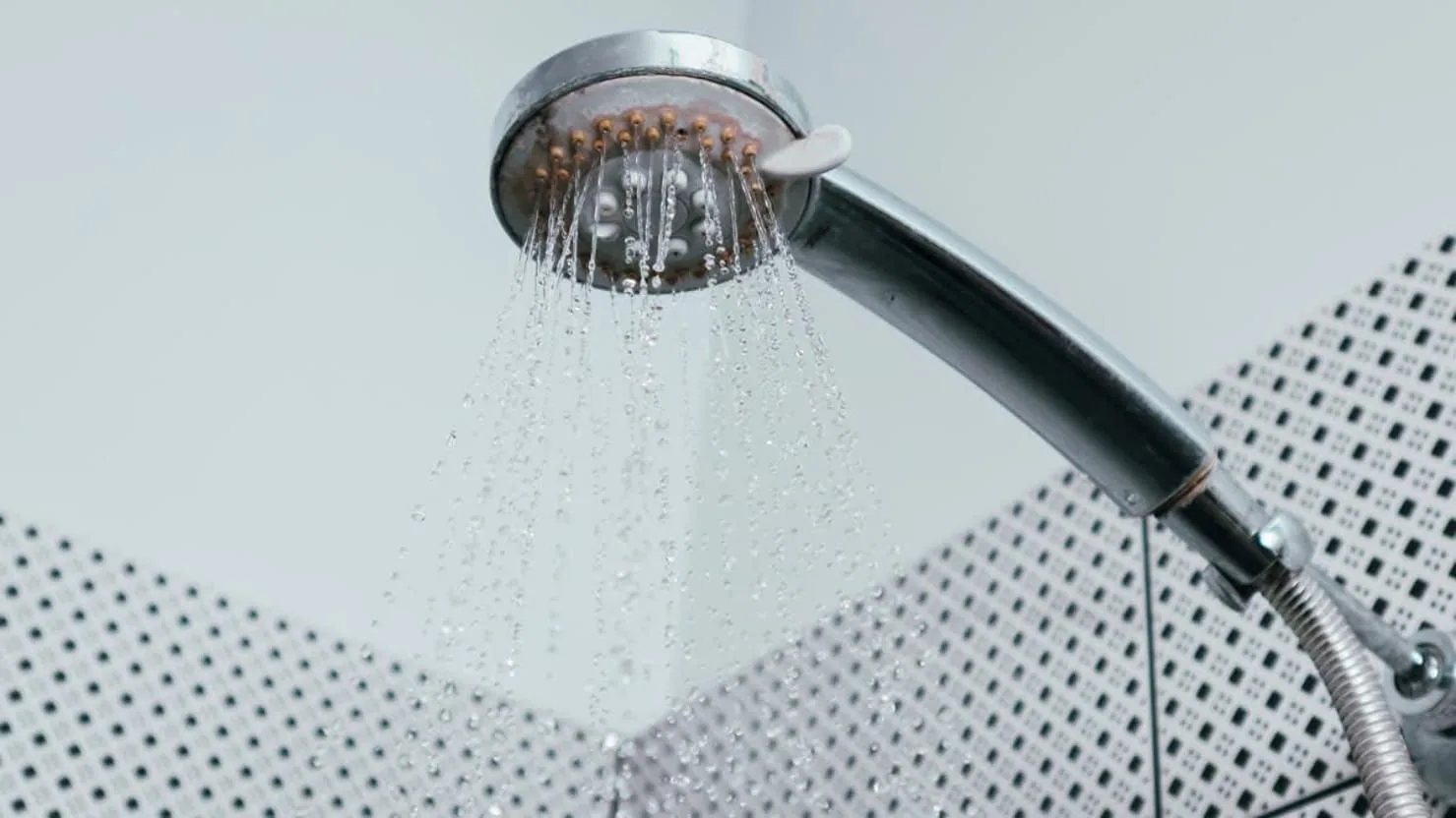 Hard water mineral and limescale buildup on a kitchen faucet