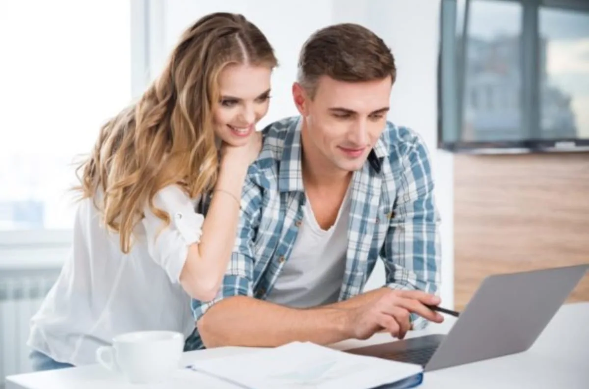 Homeowner reviewing HVAC financing options on a laptop at home