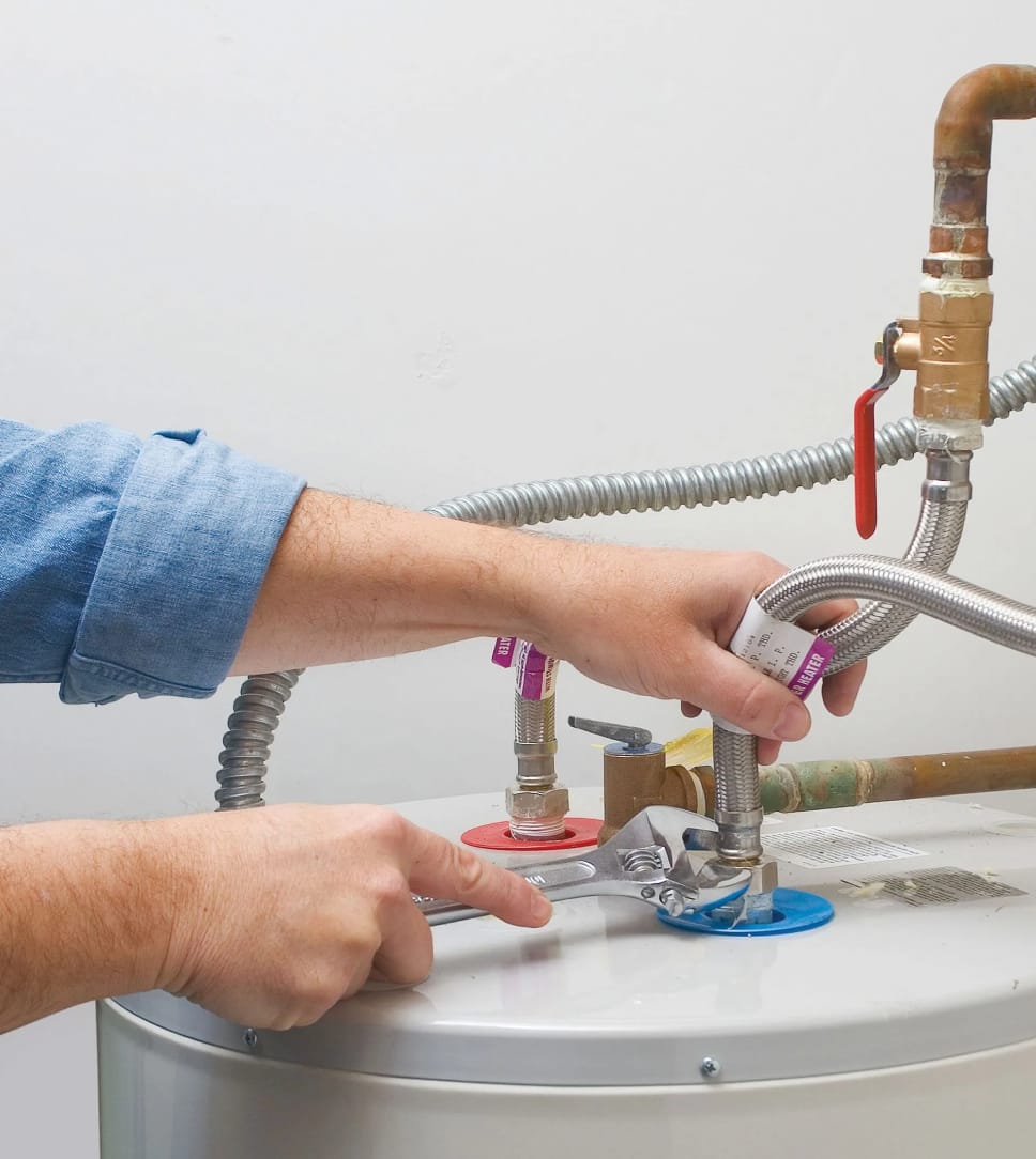 Water heater with insulated pipes in a basement during winter